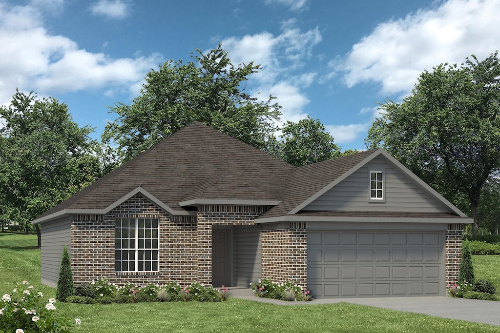 view of front facade featuring a garage and a front yard