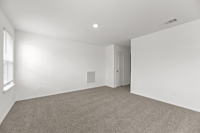 unfurnished room featuring carpet