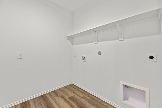 laundry room featuring hookup for an electric dryer, laundry area, hookup for a washing machine, baseboards, and wood finished floors