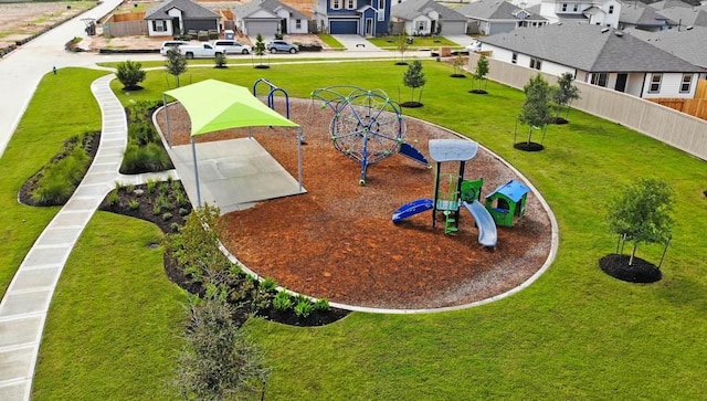 view of community with a playground and a yard