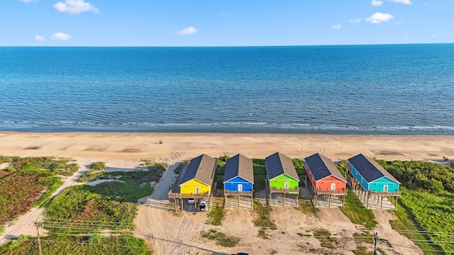 drone / aerial view with a water view and a view of the beach