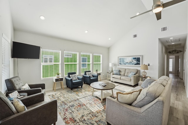 living room featuring ceiling fan, high vaulted ceiling, and wood-type flooring