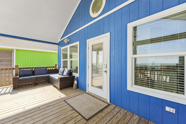 wooden terrace featuring an outdoor hangout area