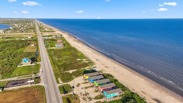 bird's eye view with a water view and a view of the beach