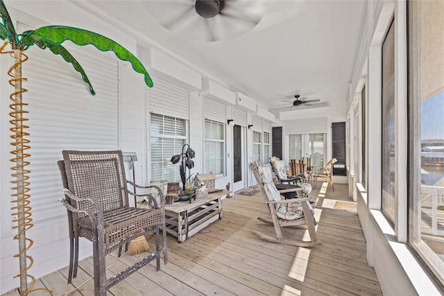 sunroom / solarium with ceiling fan