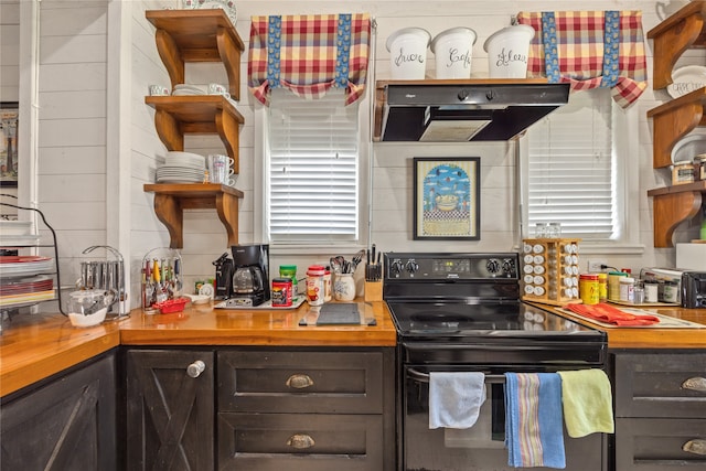 kitchen featuring dark brown cabinetry, black electric range, and extractor fan