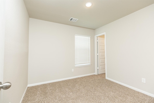 empty room featuring light colored carpet