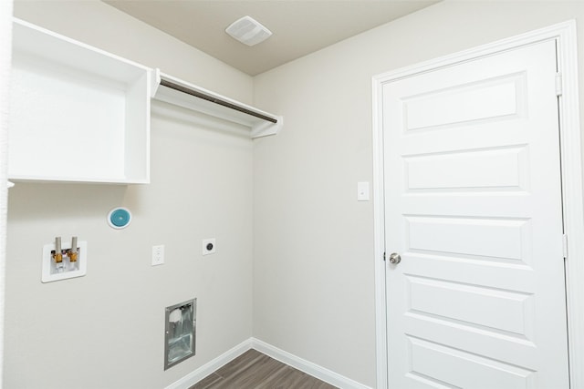 clothes washing area with hookup for an electric dryer, hookup for a gas dryer, dark hardwood / wood-style flooring, heating unit, and hookup for a washing machine