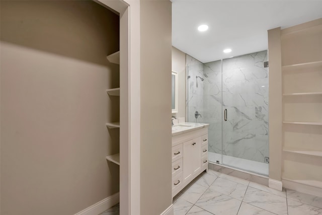 bathroom featuring vanity, built in features, and an enclosed shower