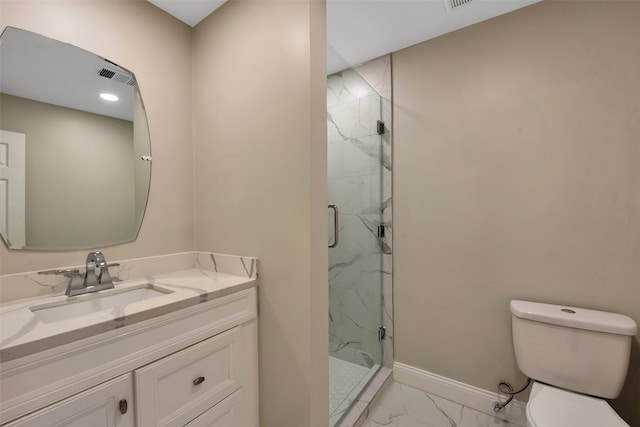 bathroom with vanity, toilet, and an enclosed shower