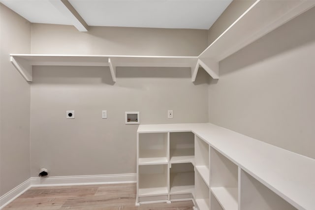 laundry room with light hardwood / wood-style flooring, electric dryer hookup, and hookup for a washing machine