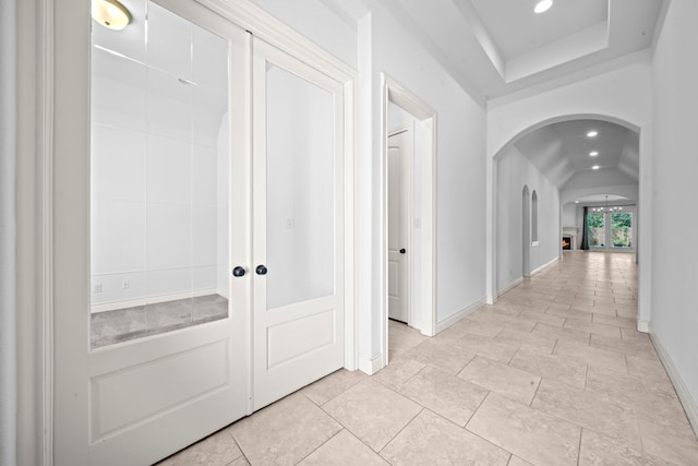 hallway featuring vaulted ceiling