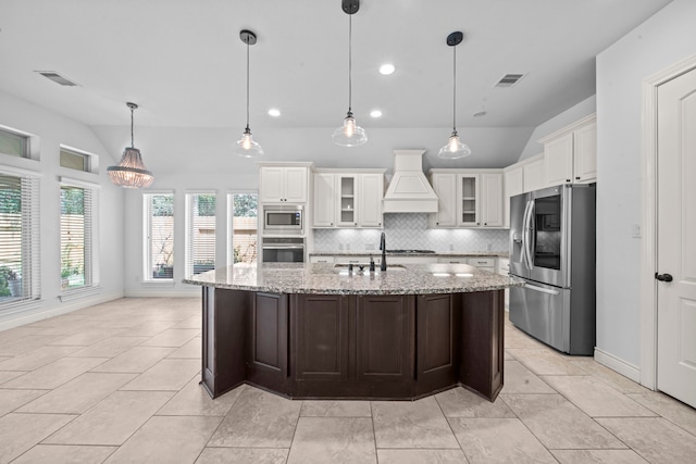 kitchen featuring sink, stainless steel appliances, backsplash, white cabinets, and custom range hood