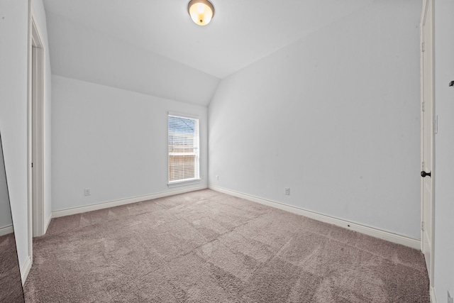 interior space featuring carpet floors and lofted ceiling