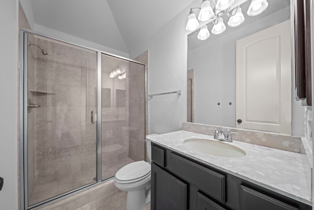 bathroom featuring vanity, vaulted ceiling, tile patterned flooring, toilet, and a shower with shower door