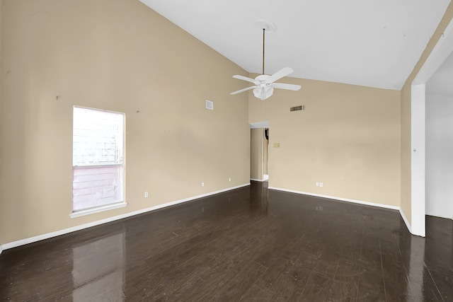 empty room with high vaulted ceiling, ceiling fan, and dark wood-type flooring