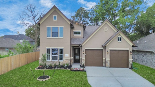 view of front facade with a front yard and a garage