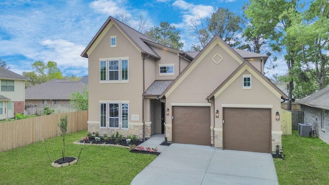 view of front of property with central AC unit, a garage, and a front lawn