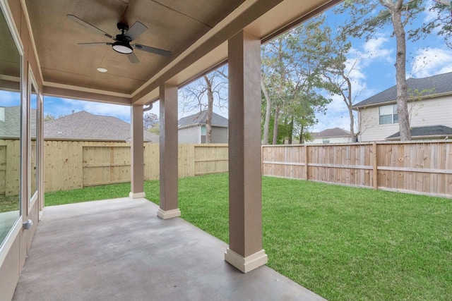 view of yard with a patio and ceiling fan