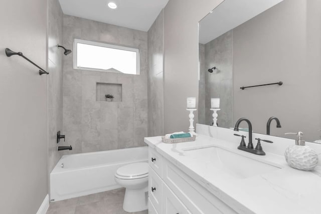 full bathroom with tile patterned flooring, vanity, toilet, and tiled shower / bath