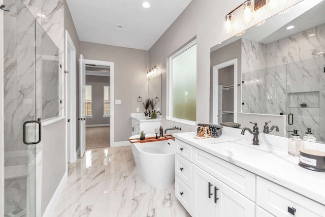 bathroom with vanity and separate shower and tub