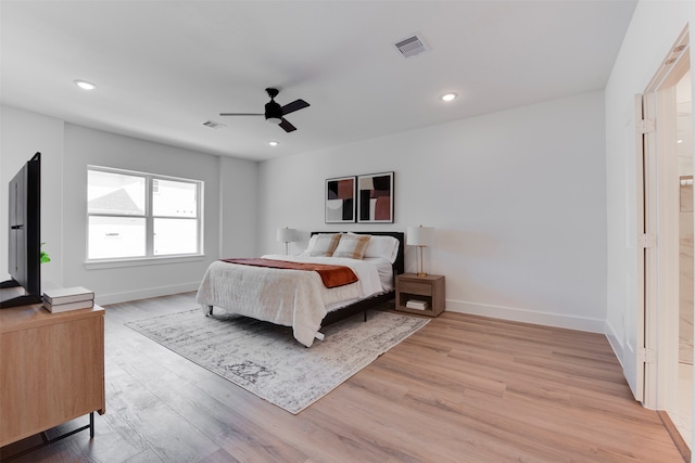 bedroom featuring light hardwood / wood-style floors and ceiling fan