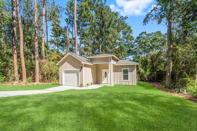 view of front of property with a garage and a front yard