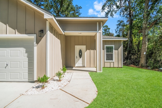 doorway to property featuring a lawn