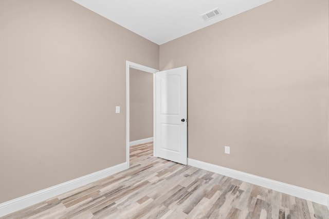 empty room with light hardwood / wood-style floors