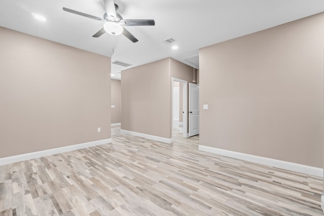 spare room with ceiling fan and light hardwood / wood-style flooring