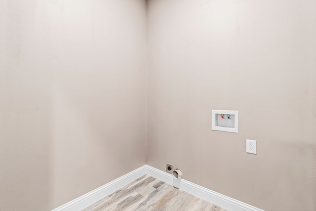 laundry area featuring hookup for a washing machine, hookup for an electric dryer, and hardwood / wood-style flooring