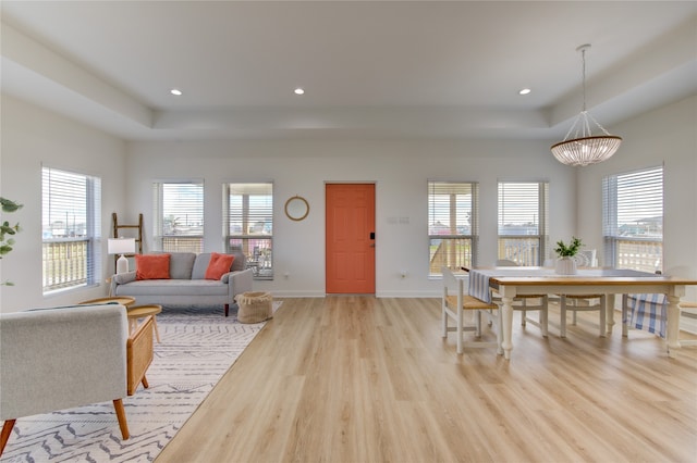 dining room featuring a notable chandelier and light hardwood / wood-style floors