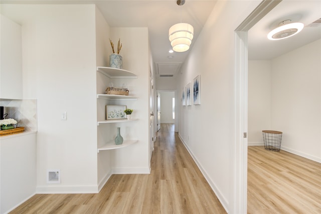 corridor featuring light hardwood / wood-style floors