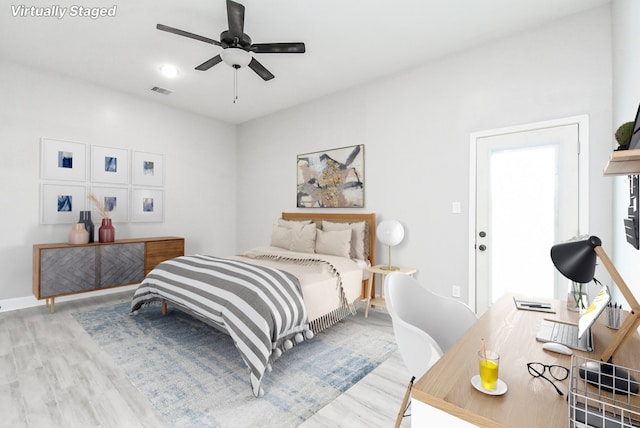 bedroom with ceiling fan and light wood-type flooring