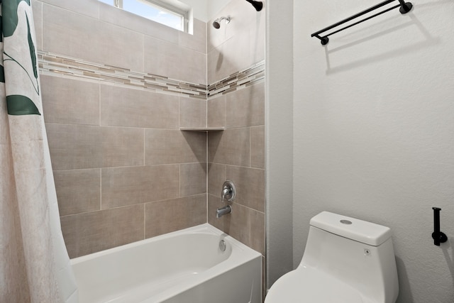 bathroom featuring toilet and shower / bath combination with curtain