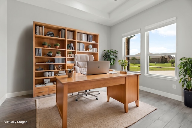 office space with wood-type flooring