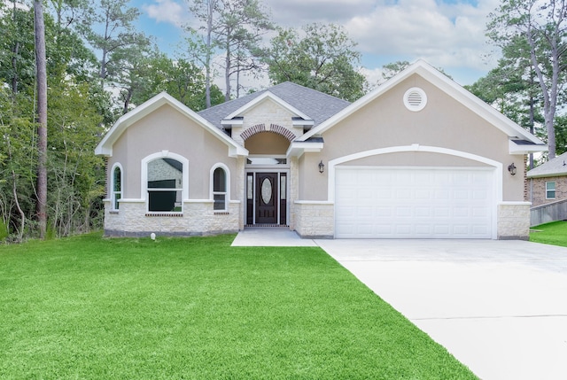 view of front of house featuring a garage and a front lawn