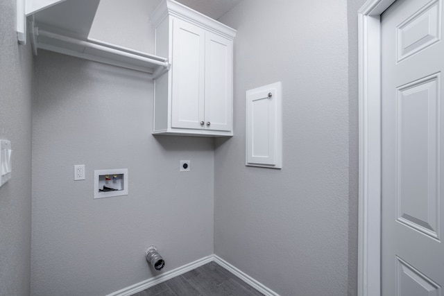 laundry area with washer hookup, electric dryer hookup, and cabinets