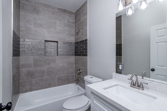 full bathroom with tiled shower / bath combo, vanity, and toilet