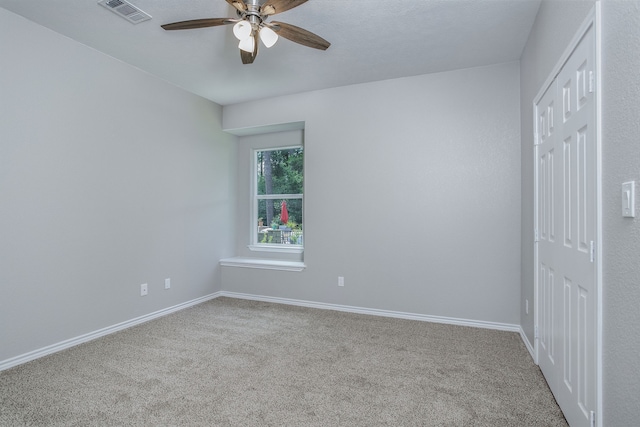 unfurnished bedroom featuring ceiling fan and carpet floors