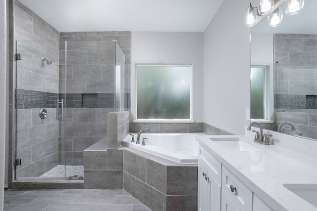 bathroom featuring vanity and shower with separate bathtub