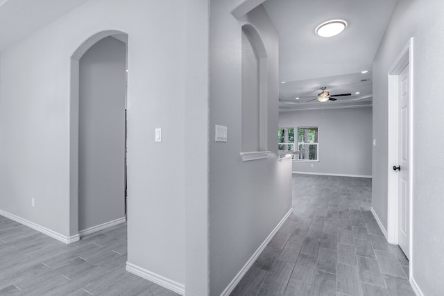 corridor with light hardwood / wood-style floors