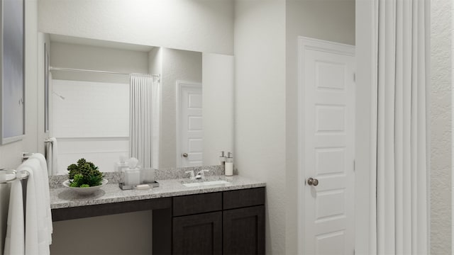 bathroom featuring vanity and curtained shower