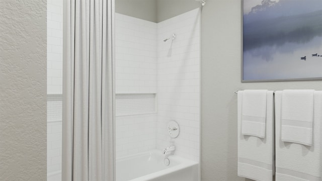 bathroom with shower / bathtub combination with curtain