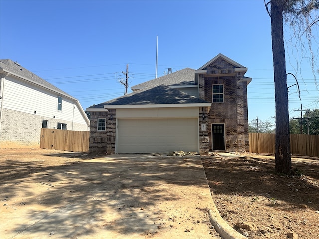 view of front of home with a garage