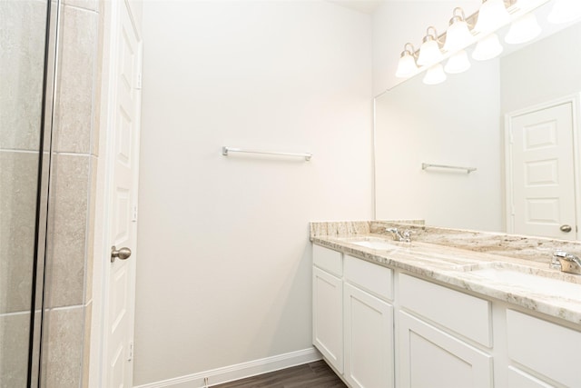 bathroom featuring hardwood / wood-style floors and vanity