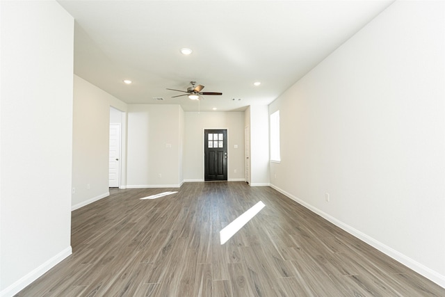 interior space with hardwood / wood-style floors and ceiling fan