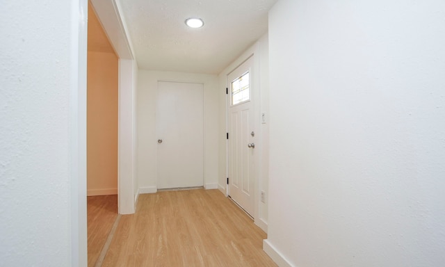 doorway with light hardwood / wood-style flooring