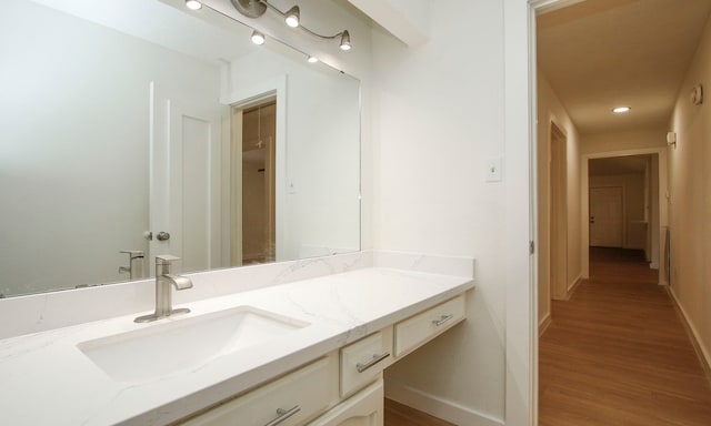 bathroom with wood-type flooring and vanity