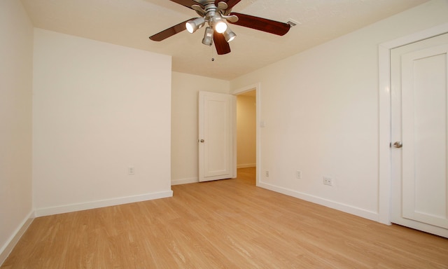 unfurnished room with ceiling fan and light hardwood / wood-style floors